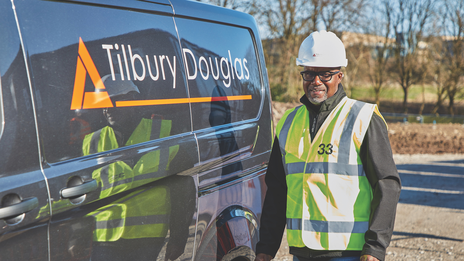 Group fleet director Cliff Lewis shows off a newly branded Tilbury Douglas van, after Interserve Construction took the name of the business back to its roots