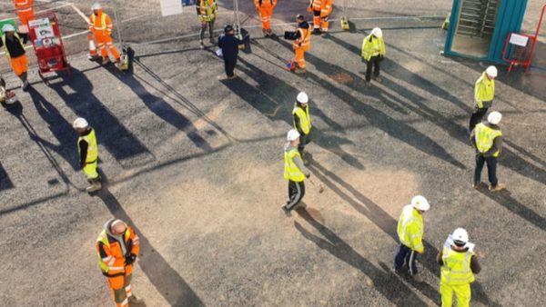 Wates workers practising social distancing following the re-opening of sites