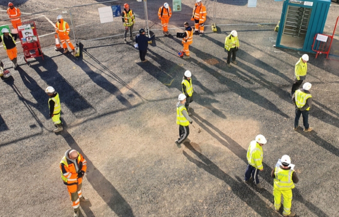 Wates workers practising social distancing following the re-opening of sites