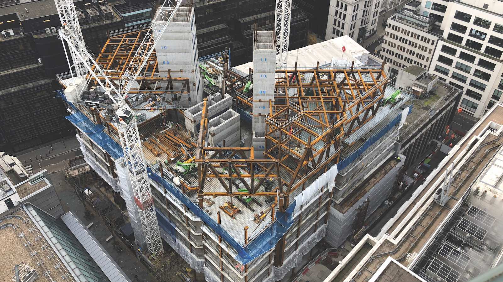 The structural frame of the residential towers begins to rise, November 2018