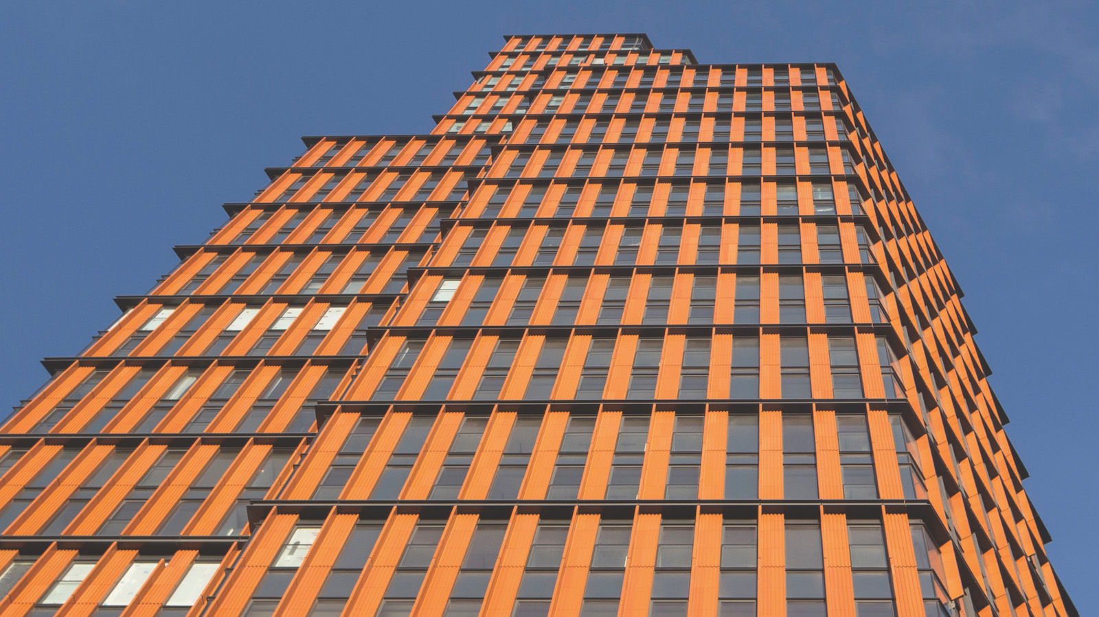 The cladding features glazed terracotta fins on the external perimeters of the towers. Photo credit: Agnese Sanvito