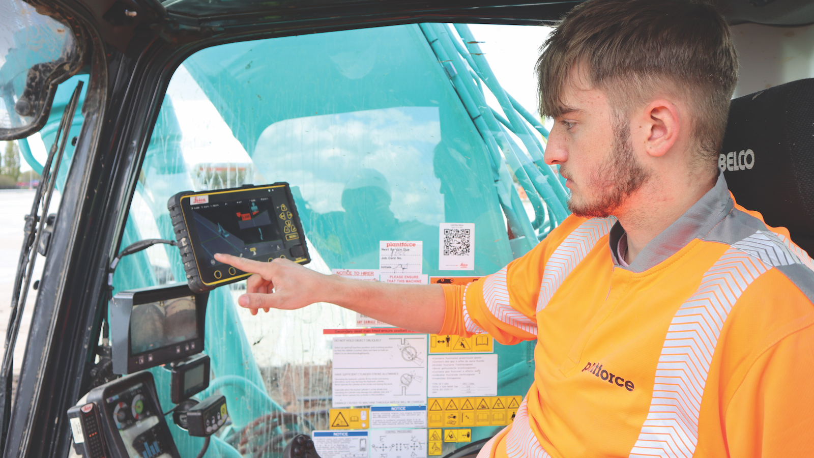 Plantforce apprentice Ted Powell using Leica machine control on a Kobelco excavator