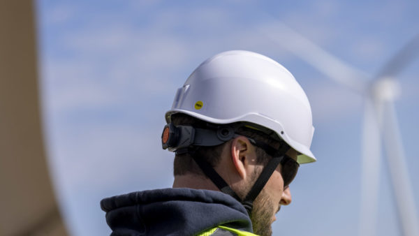A construction worker wearing a Mips-equipped hard hat (Image courtesy of Mips)