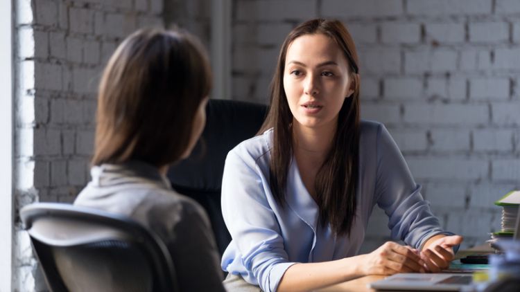 Two women in a serious meeting