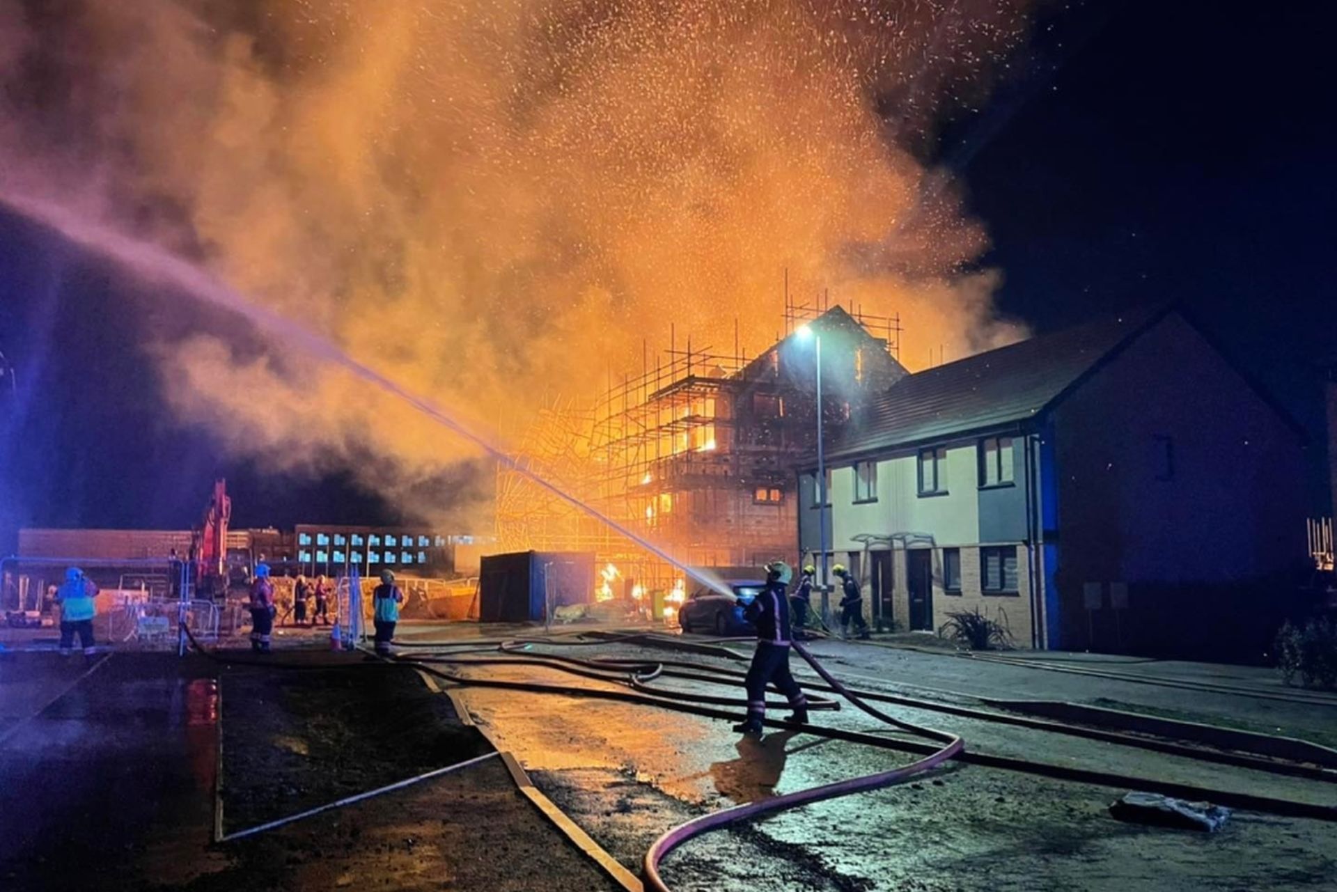 A firefighter tackles the blaze at the Keepmoat Homes site (Image courtesy of Cambridgeshire Fire and Rescue Service)