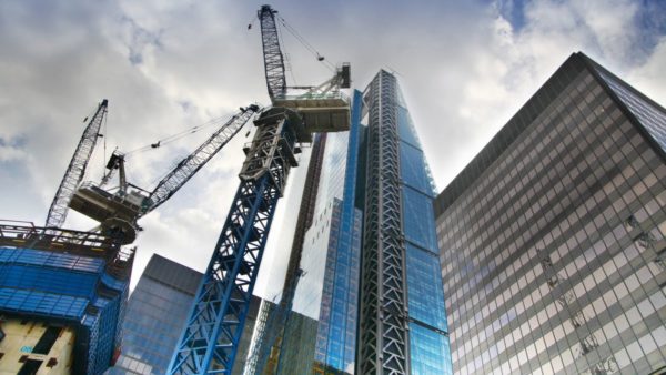Cranes set against a London skyline of tall buildings (Photo 45299671 © Irstone | Dreamstime.com)