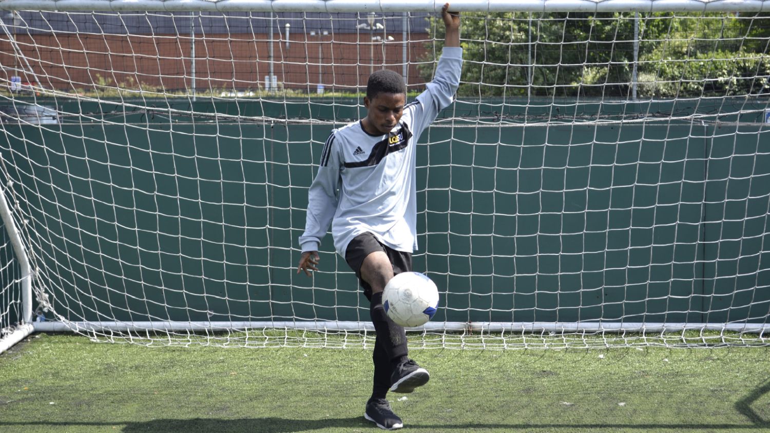 A Leeds College of Building student practises their football skills (Image courtesy of Leeds College of Building)