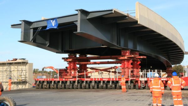 The Gull Wing bridge section, weighting nearly 1,450 tonnes and ready to be moved into position, sits on the self-propelled modular transporters. (Picture: Suffolk County Council)