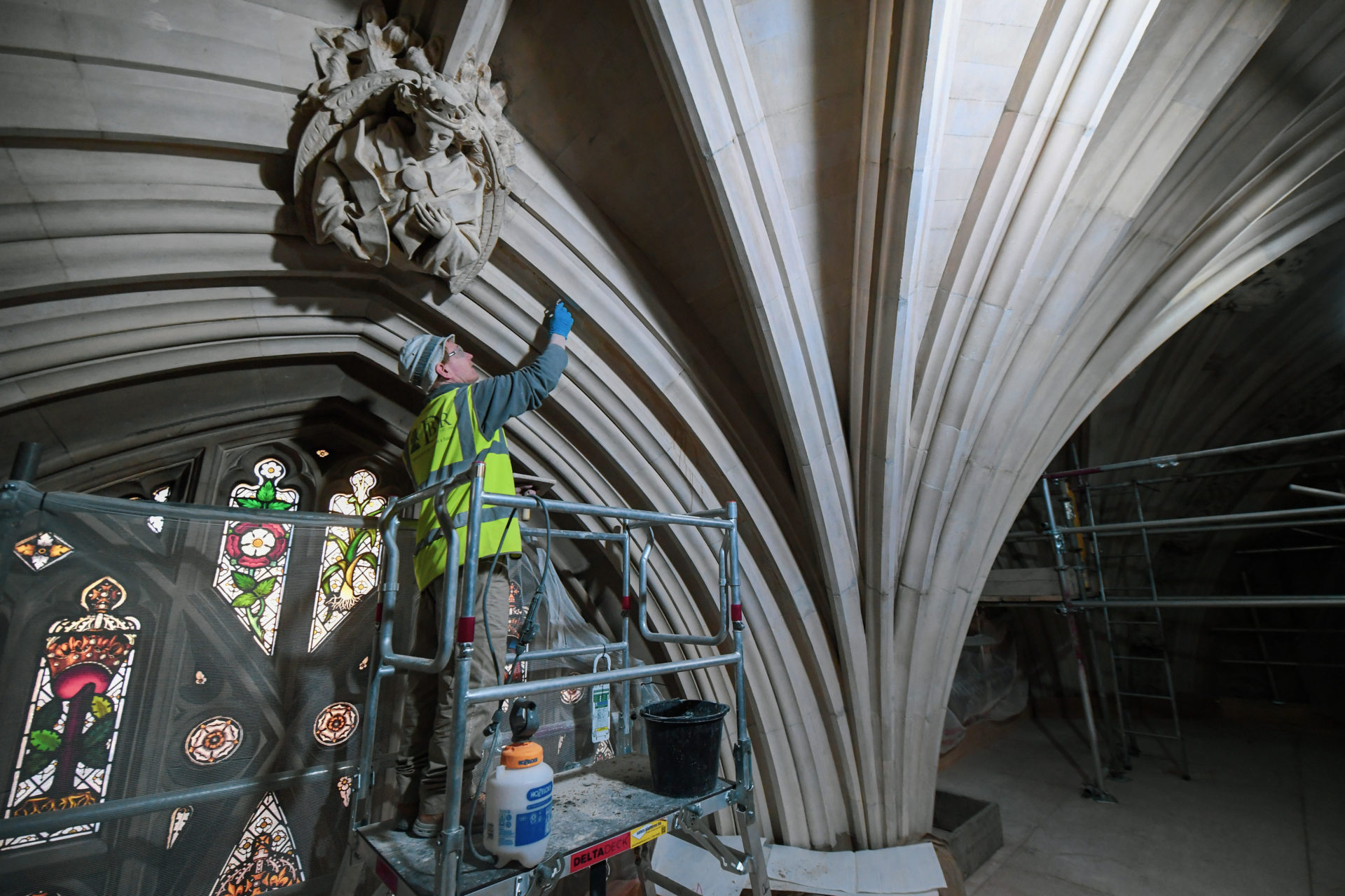 A stonemason working to restore stonework in St Stephen's Hall in the Houses of Parliament (Image: ©UK Parliament/Jessica Taylor)