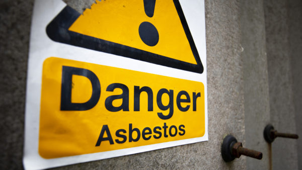 A yellow sign that reads 'danger asbestos'