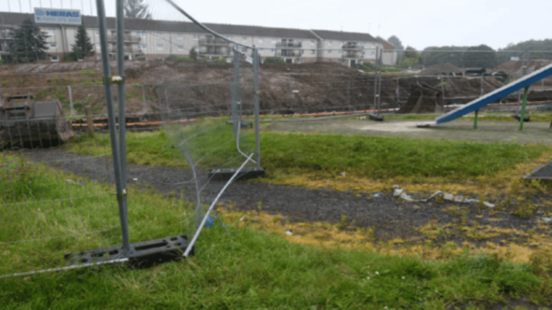 RJ McLeod - A fence near a playground.