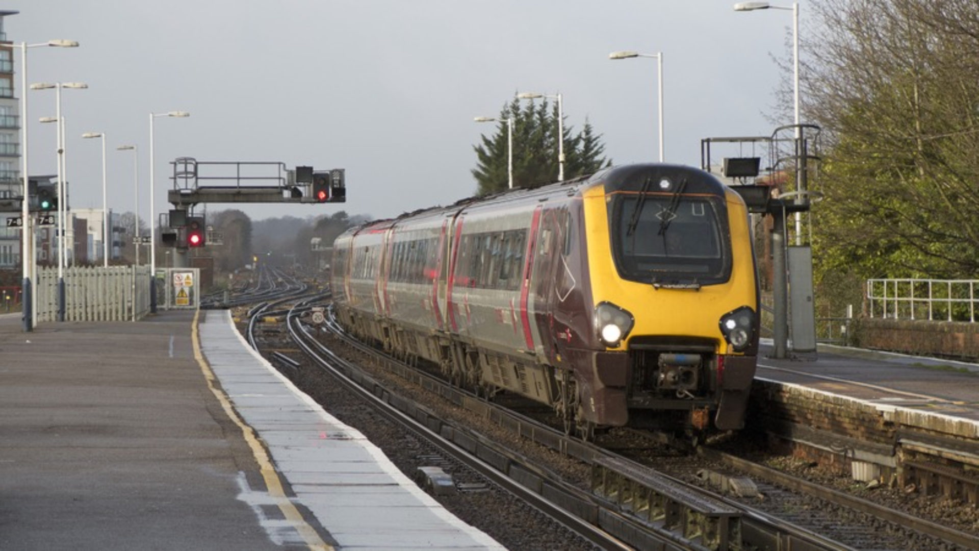 Track workers - A train in a rail station during daytime.