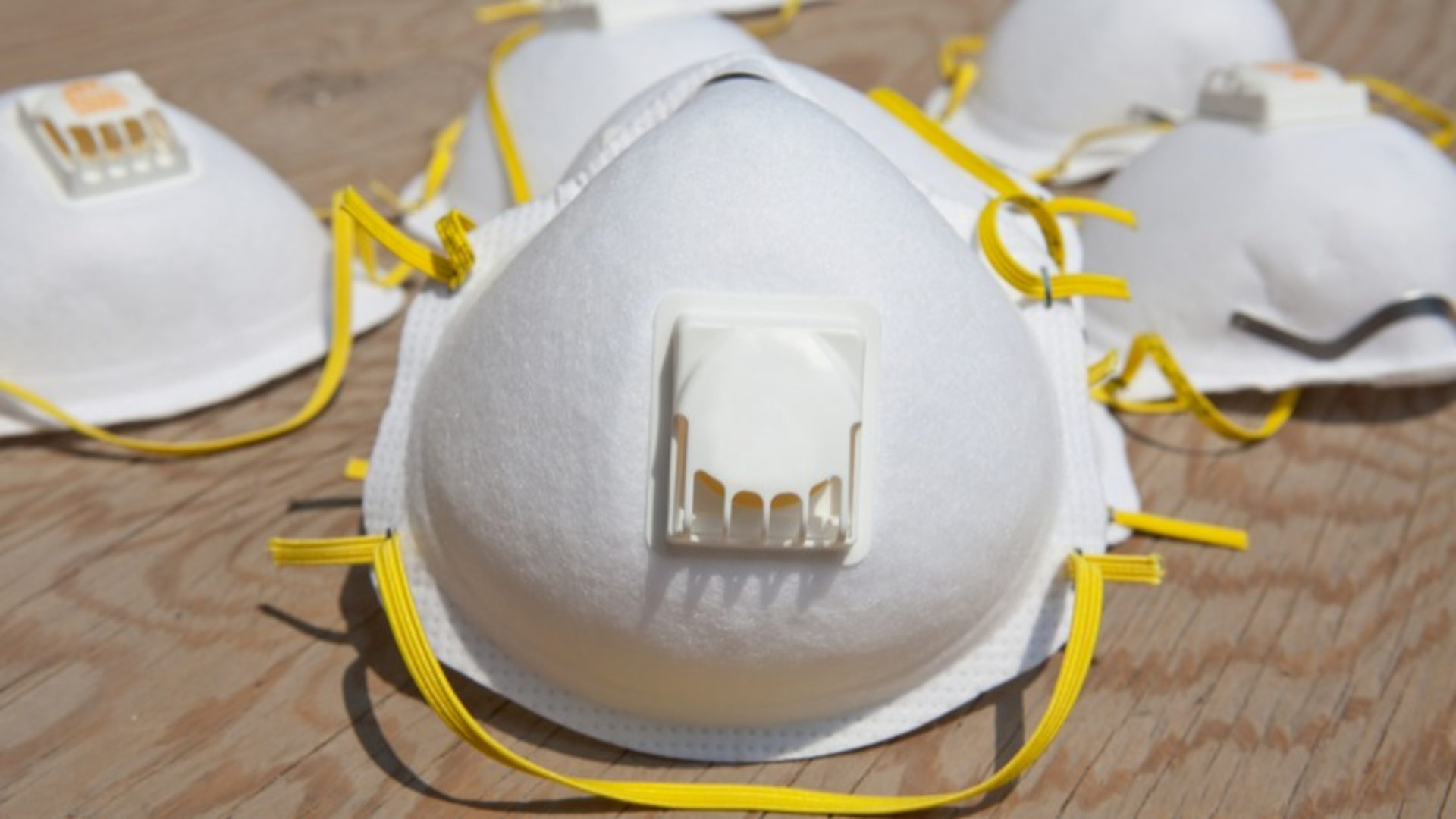 Dust inspection campaign - Five white masks with yellow strings.