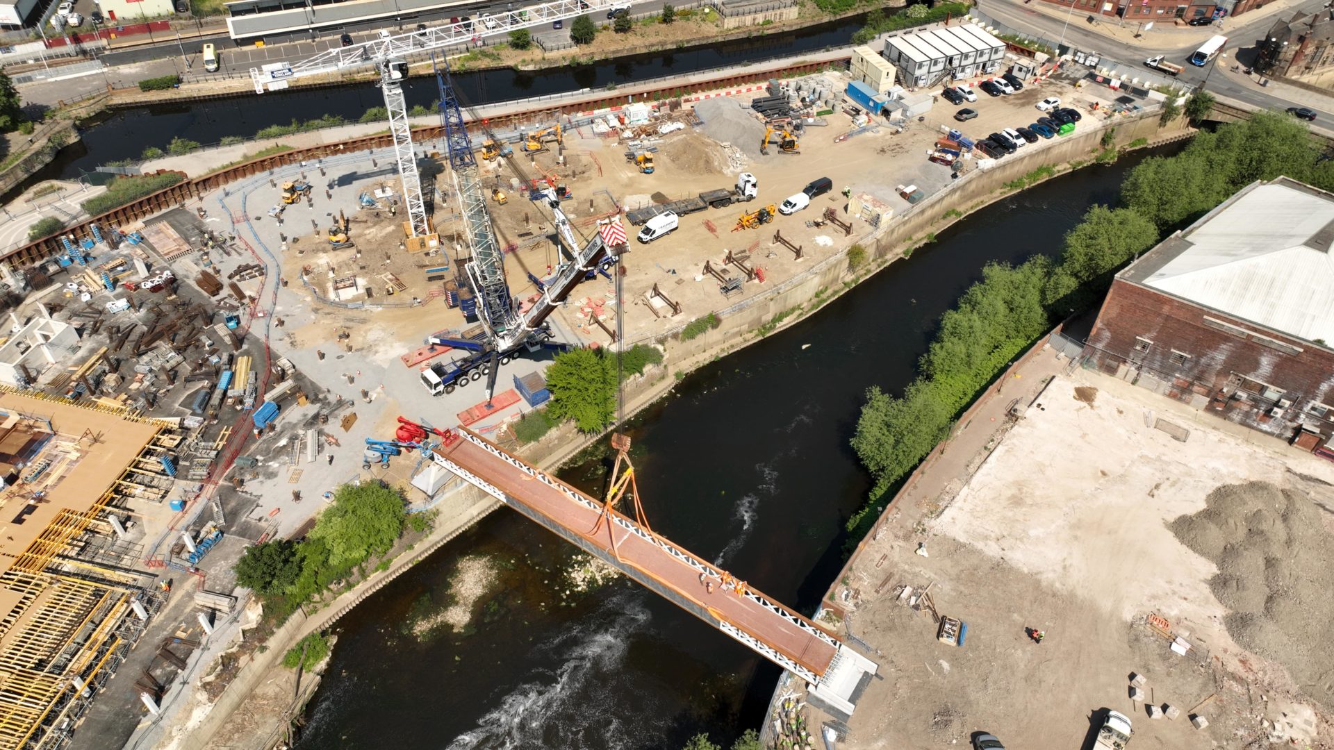 Forge Island bridge Aerial view of a bridge being lifted in place.