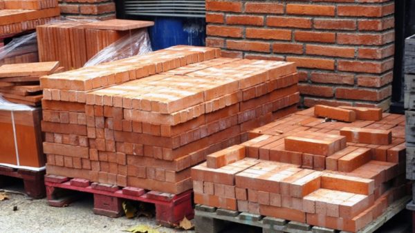 Pallets with red bricks