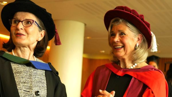 Two women in academic robes.