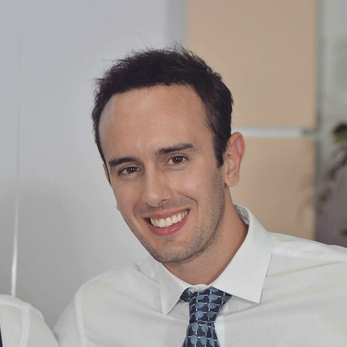 Headshot of a man smiling at the camera