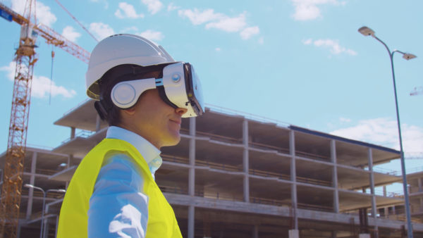 Construction worker using a virtual reality headset.