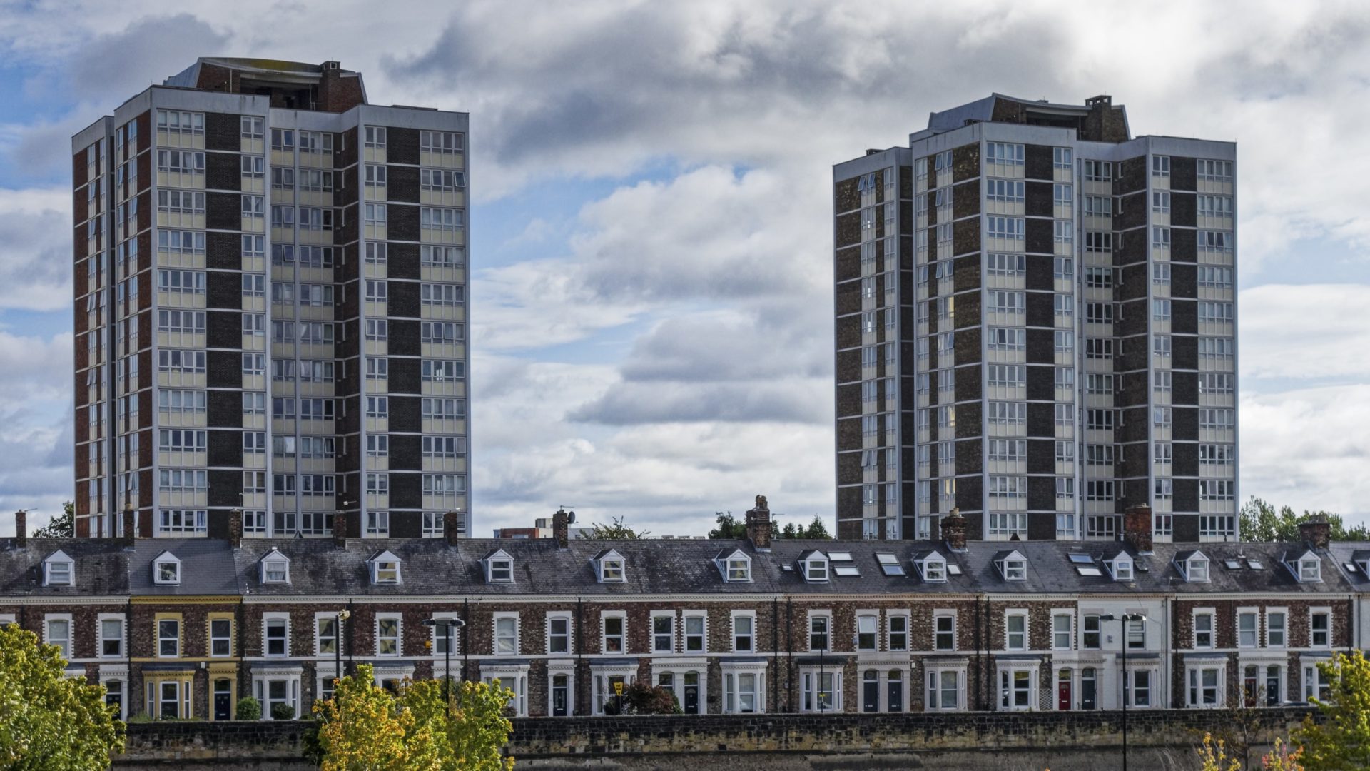 A view of high rises and terraced houses.