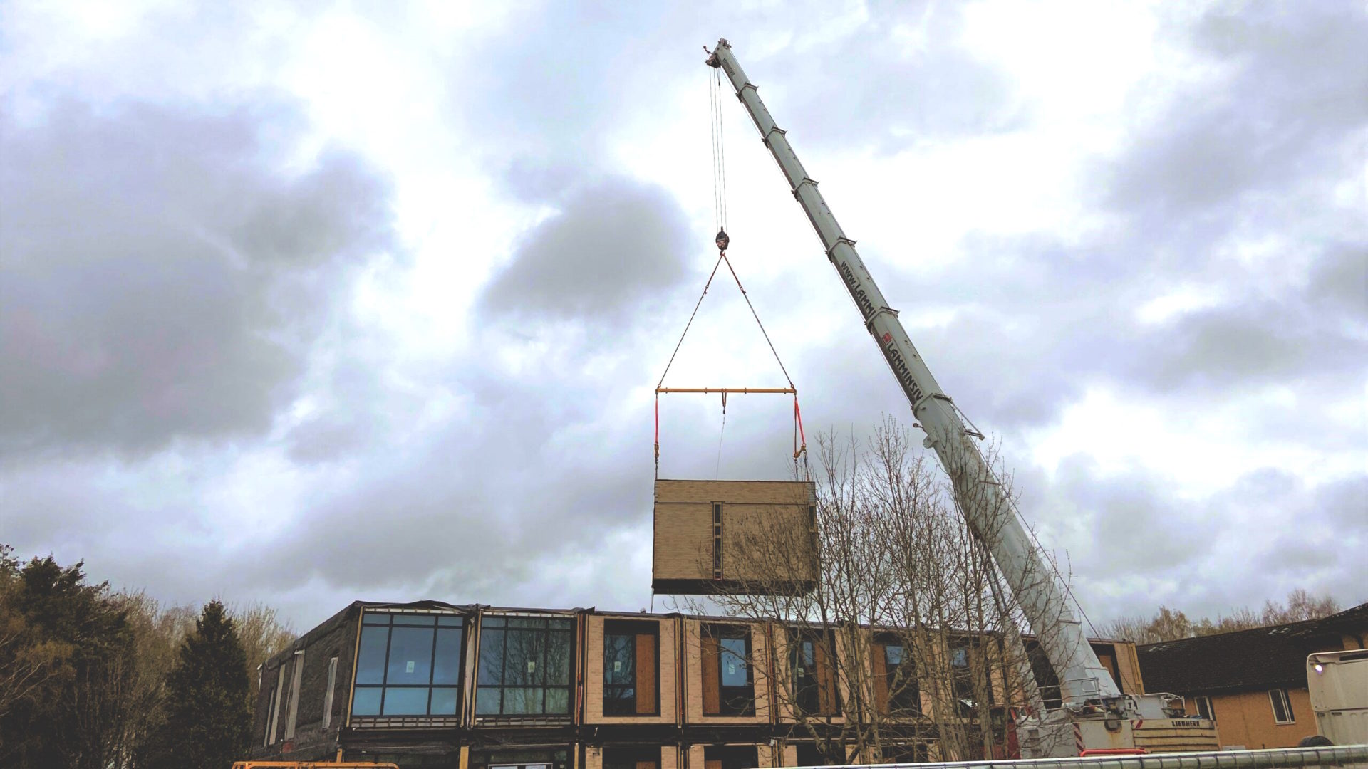 defence net zero - A 20-tonne module being craned into position at the new Single Living Accommodation block at Imjin Barracks (image: Reds10)