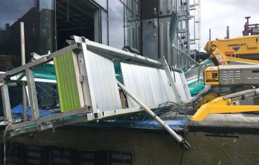 A fallen cradle at a construction site.