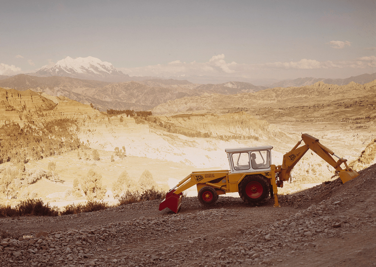 JCB backhoe loader - A yellow excavator at work in the 1970s.
