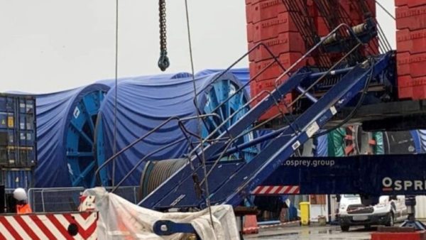 A collapsed crane in a construction site.