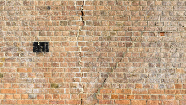 A brick wall with a crack.