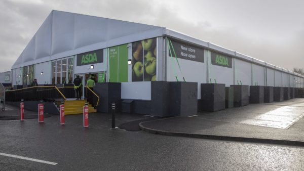 A temporary supermarket structure with Asda branding.