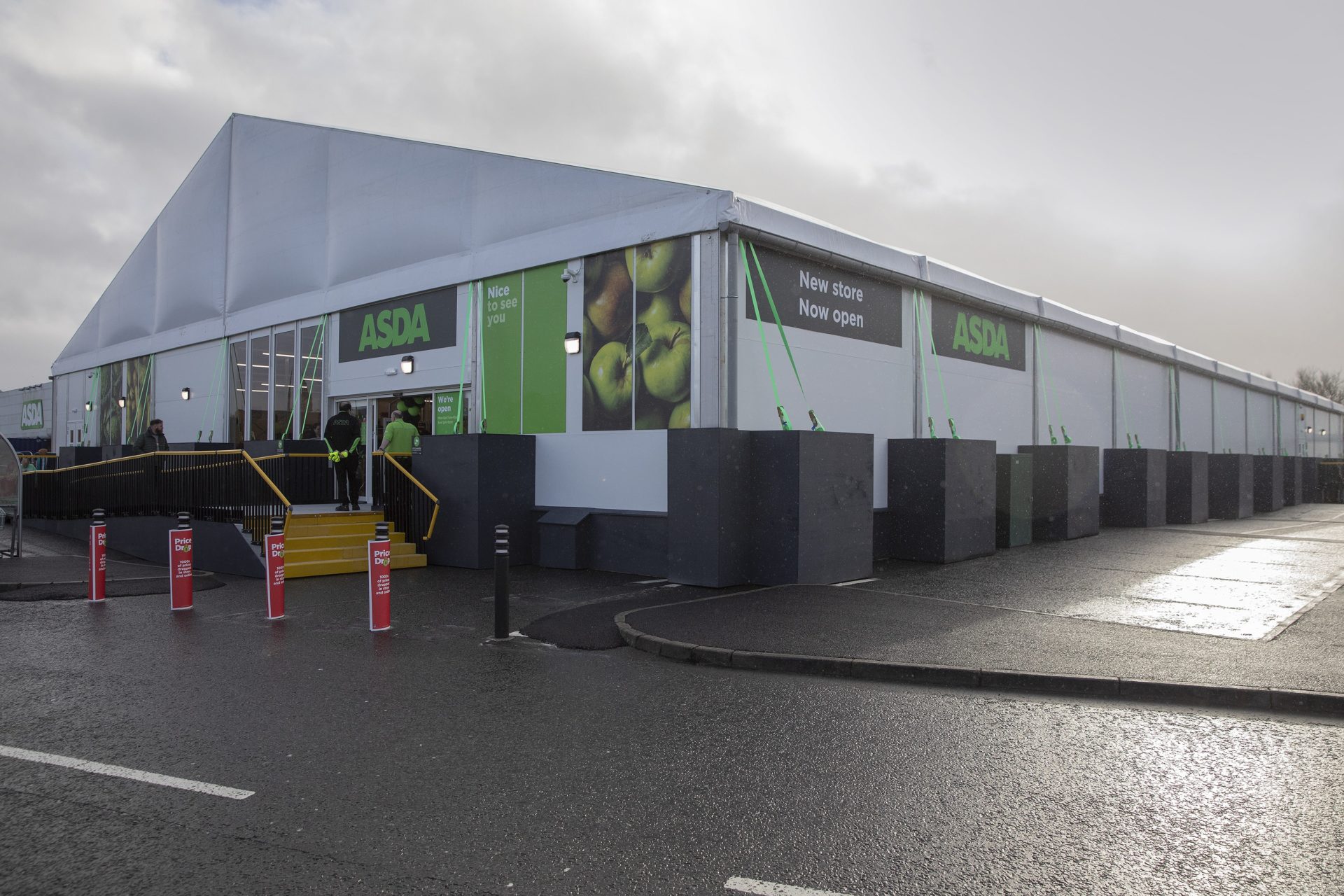 A temporary supermarket structure with Asda branding.