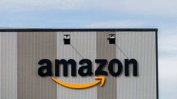 An Amazon logistics warehouse with the Amazon logo - the company has partnered with CIBSE to produce a guidance to reduce the carbon footprint of logistics centres