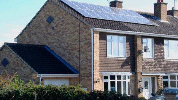A house with solar panels fitted to the roof. The Construction Leadership Council has published a report setting a competency framework for domestic retrofitting in the UK.