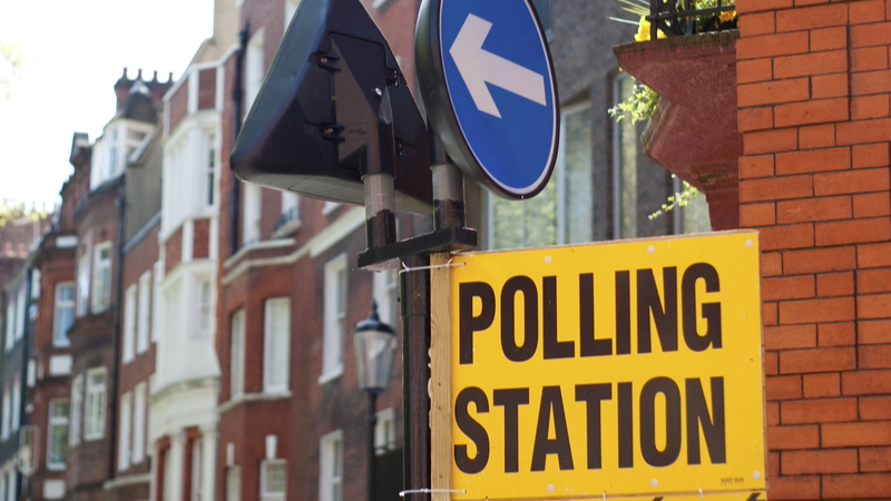 Polling station sign in a UK street - CIOB has launched its manifesto ahead of the 4 July general election