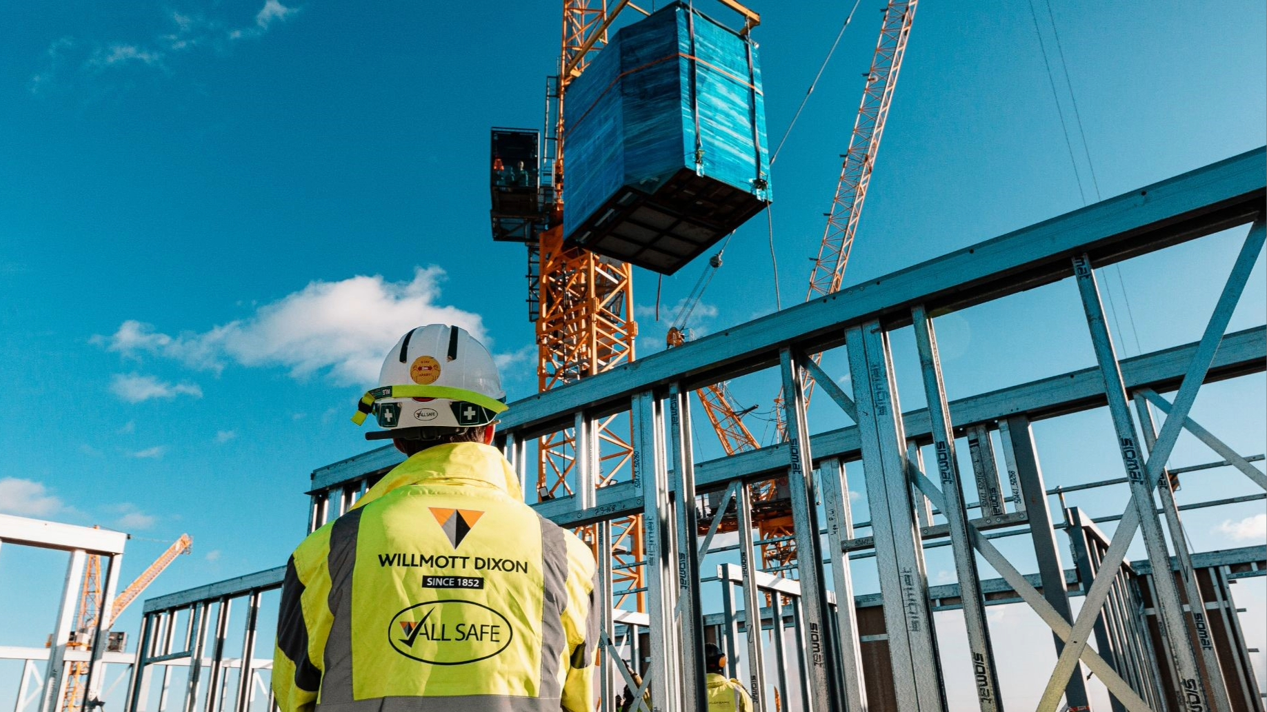 A Willmott Dixon employee in full PPE on site.