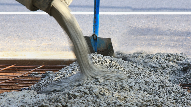 Concrete-nitrogen mix. Concrete being poured - researchers have found that Adding nitrogen to concrete could reduce the amount of harmful pollution created in construction
