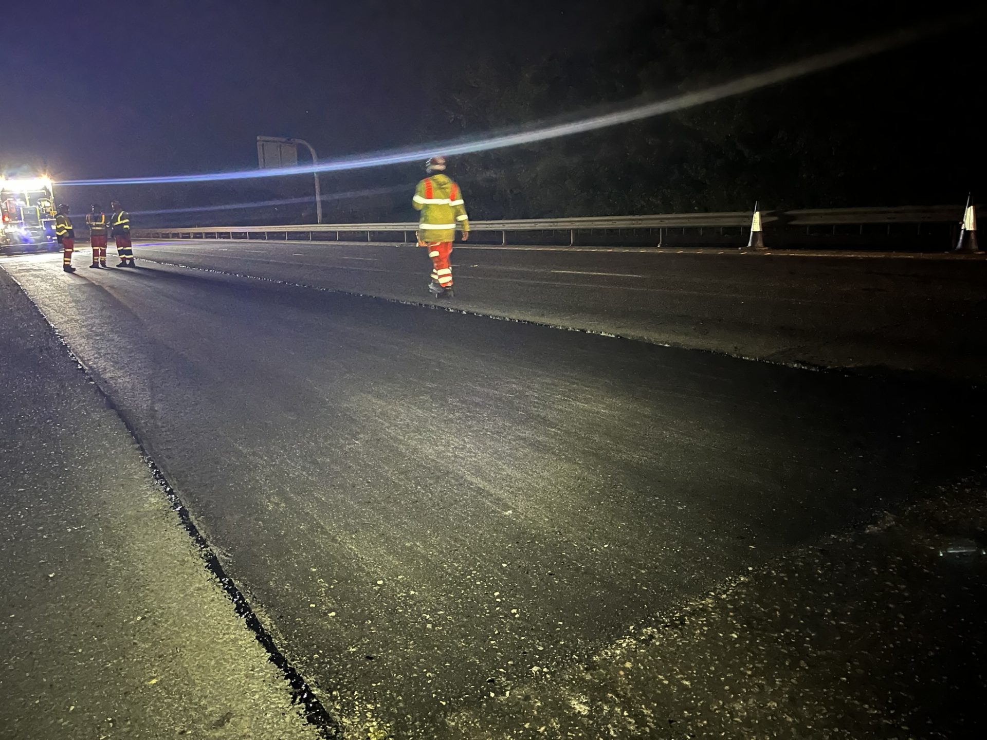 Carbon-negative aggregate - The trial material is laid on the M11 at night.