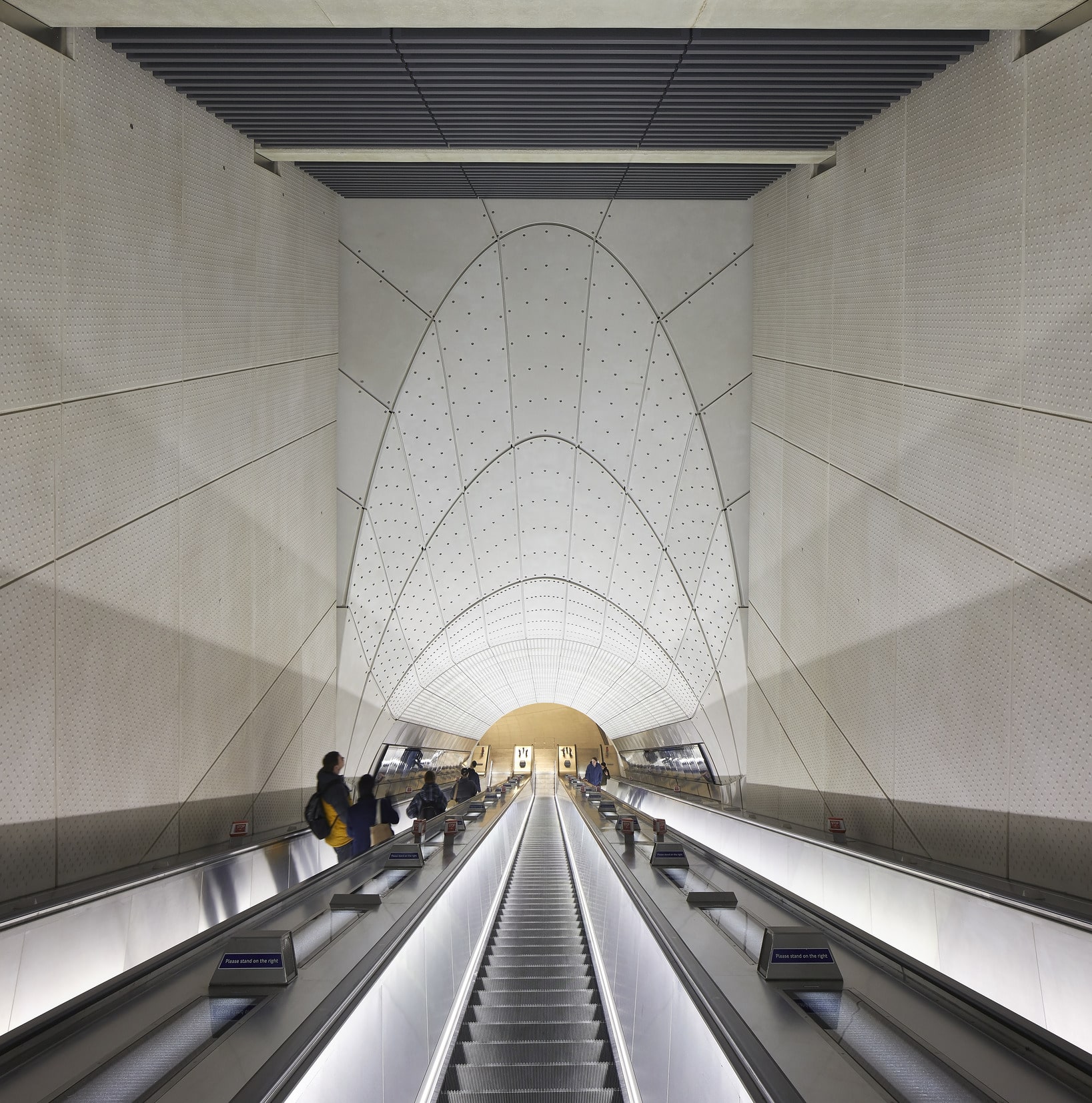 Stirling Prize shortlist - Escalator with people inside an Elizabeth Line station.