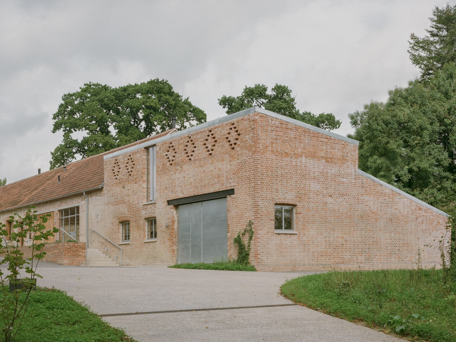 Restored buildings around the southern farmyard. The approach route leads to parking behind, and on to holiday cottages around the northern courtyard.