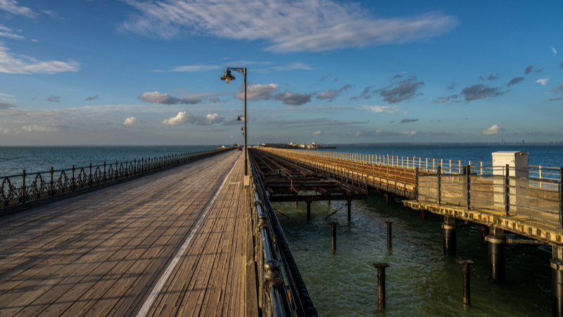 The Ryde Pier with the Pier Head in the background in Ryde, Isle of Wight, England, UK.