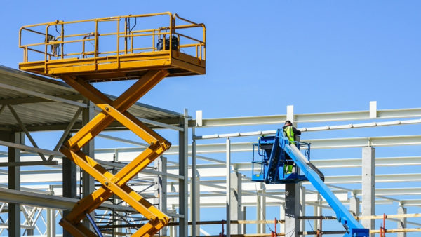 A mobile self propelled hydraulic lifting platform and scissor lift in action