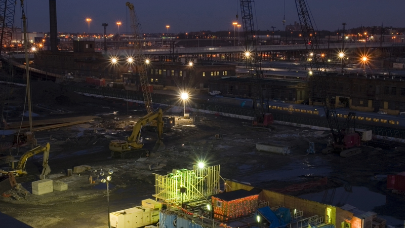 A construction site at night with Christmas decoration - a new report found that all CMA investigations in the construction industry that resulted in an infringement decision invoved dawn raids.