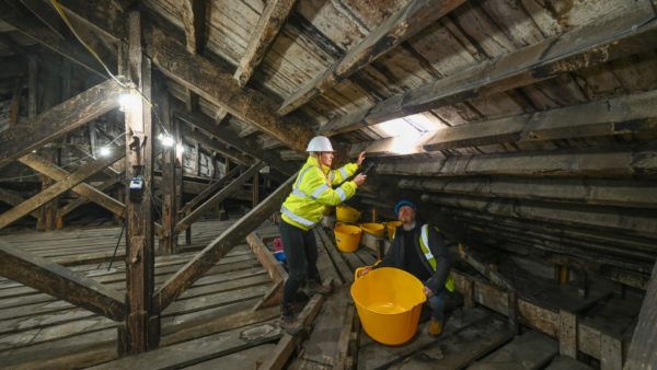 Two workers inspecting the roof timbers at Blenheim Palace, which in January 2025 will begin a £10.4m restoration.