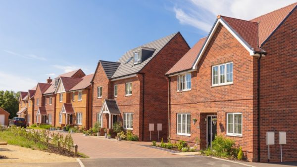 A row of detached new build homes. The government has accepted the CMA's recommendation to develop a single mandatory consumer code for housebuilders.