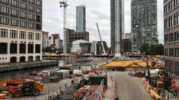 Construction workers work on a development in Canary Wharf, London.