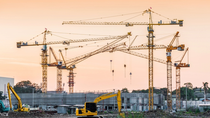 Building construction site with tower crane machinery - A recent large spike in contract awards suggests that the negative effects of ISG collapse are still to come, construction analyst Barbour ABI said.