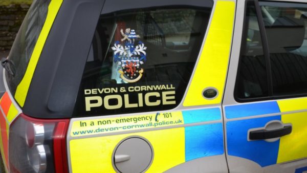 Close up of a Devon and Cornwall police car - a highways worker has died after a multi-vehicle collision on the A30