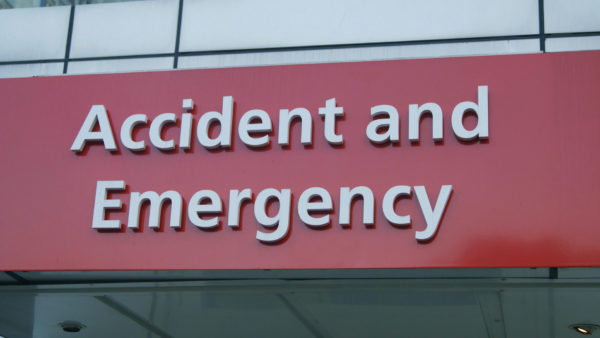 Accident and emergency sign in a hospital - A construction company has been fined after a builder was left paralysed as a result of falling through a ceiling.