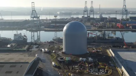 Aerial view of a giant white dome in a construction site - Aggregate Industries has inflated it as part of a new cement factory in Essex.