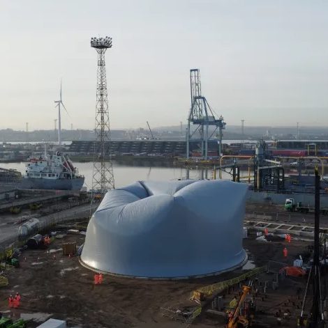 PVC silo - Aerial view of the giant white dome being inflated in a construction site - Aggregate Industries has inflated it as part of a new cement factory in Essex