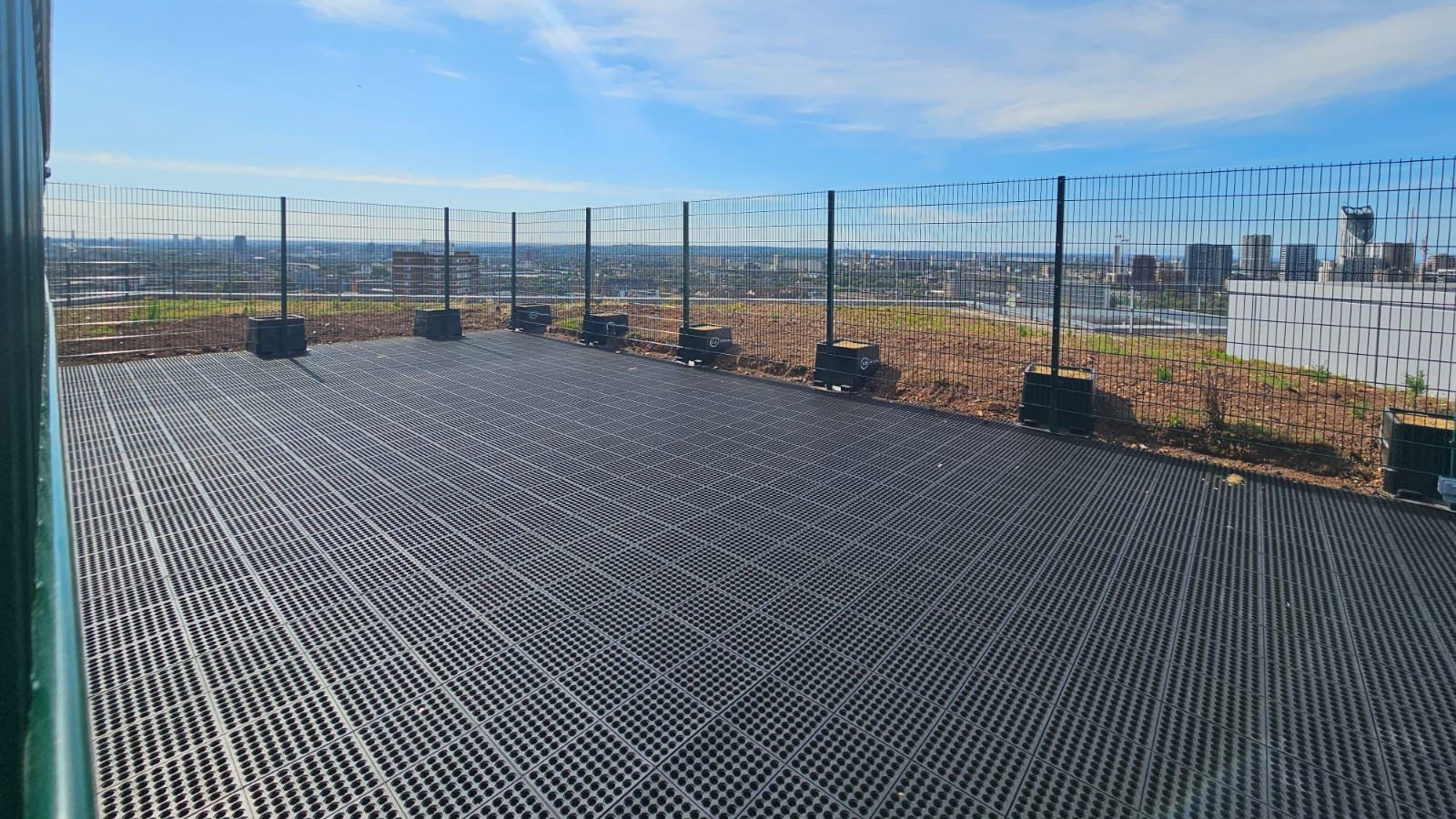 CK Group Services - The drone landing area made of rubber. There's a fence surrounding it - a contractor has installed a drone landing area at a major NHS hospital.